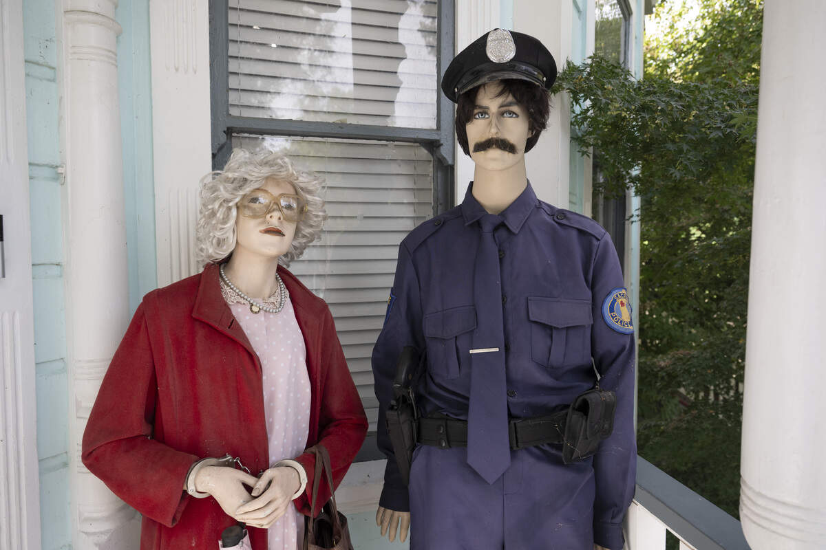 Mannequins dressed as serial killer Dorothea Puente and a Sacramento police officer are posed outside Puente’s former house, now known as The Innocent House, during Preservation Sacramento’s annual historic home tour in Sacramento on Sunday. Puente, who operated the home as a boarding house, murdered nine of the home’s lodgers and buried them in the yard in the 1980s.